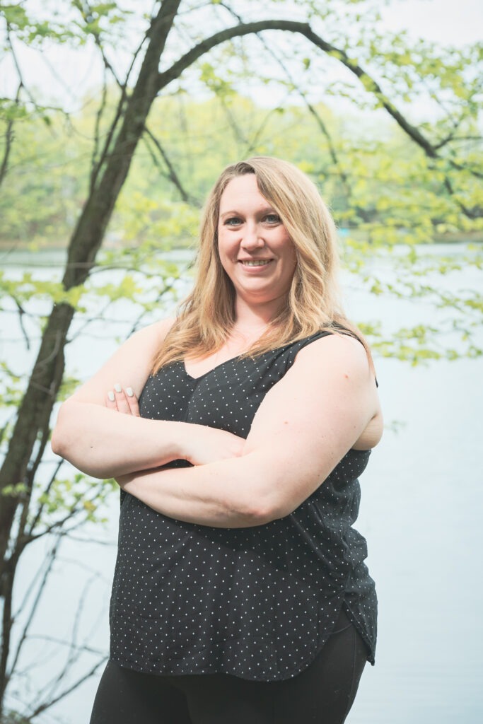 Kelsi standing in front of her lake